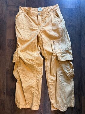 BDG Wide-Leg Cargo Jumpsuit Pants in faded Mustard size 10 pockets elastic back